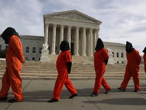 Protesters gather in front of the U.S. Supreme Court to mark 15 years since the first prisoners were brought to the U.S. detention facility in Guantanamo Bay, Cuba on January 11, 2017 in Washington, DC. (AFP/Joe Readle)