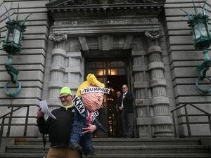 Mihael Petrelis glances at the appellate court's decision outside a federal appeals court after it ruled against lifting the stay on U.S. President Donald Trump's executive order imposing a temporary immigration ban on seven Muslim-majority nations in San Francisco, California. (AFP/Elijah Nouvelage)