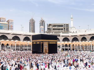 People walking around 7 circles making Tawaf, a part of Hajj and Umrah. (Shutterstock)