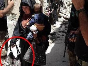 The woman in this photo reportedly blew herself up moments later (al-Mawsleya)