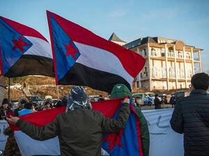 Protesters holding South Yemen flags demand independence for the region during a protest. (AFP/File)