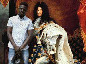 Mamoudou Gassama with infamous member of French aristocracy, Louis XIV (Rami Khoury/Al Bawaba)