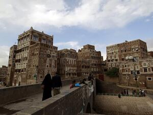 Residents walk toward the old city of Yemen's capital, Sanaa. (AFP/Mohammed Huwais)