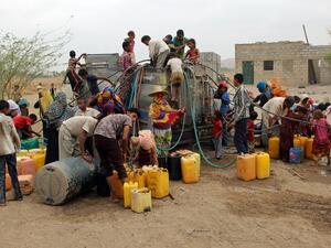 Yemenis collect water from a donated source amid an ongoing wide spread disruption of water supplies in an impoverished coastal village on the outskirts of the Yemeni port city of Hodeidah, on April 17, 2017. (AFP/Stringer)