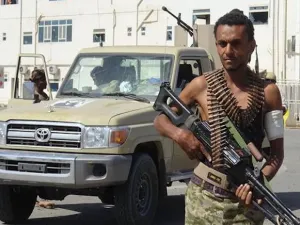 A Saudi-sponsored militiaman loyal to former Yemeni president Abd Rabbuh Mansur Hadi is pictured in front of the May 22 Hospital on the eastern outskirts of port city of Hudaydah, Yemen, on November 15, 2018. (Photo by AFP)