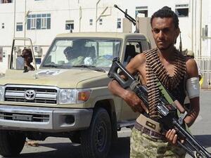A Saudi-sponsored militiaman loyal to former Yemeni president Abd Rabbuh Mansur Hadi is pictured in front of the May 22 Hospital on the eastern outskirts of port city of Hudaydah, Yemen, on November 15, 2018. (Photo by AFP)