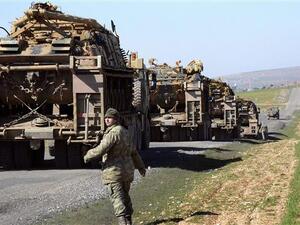 Turkish Army vehicles and tanks move near the Syrian border in rural district of Suruç on February 23, 2015. (AFP/File)