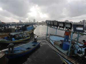  Palestinian fishermen at the port of Gaza City (AFP/File Photo)