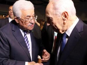 Mahmoud Abbas and the late Shimon Peres (AFP/File)