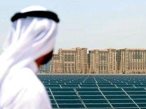 An Emirati man looks at the solar power platform at Masdar City, on the outskirts of Abu Dhabi. (AFP)