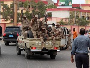 Loyalist forces drive on a main road in the Mansoura residential district of Yemen's second city of Aden after they pushed Al-Qaeda out of parts of the southern city on March 30, 2016. (Saleh al-Obeidi)