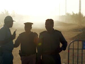 Egyptian policemen guard the road to Saint Samuel monastery in Minya province after the attack on a bus carrying Coptic Christians. (AFP/File)