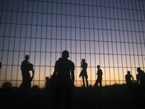 Palestinian protesters clash with Israeli soldiers near the border fence between Israel and the Gaza Strip (AFP/File Photo)	