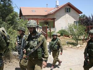 Jewish settlers with Israeli troops converged on a Palestinian town that was scene of fierce confrontations last month. (AFP/File Photo)