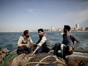 In 2016, Israel's military detained 113 fishermen and the navy routinely opens fire at fishermen to enforce the limited fishing zone. (AFP/ Mahmud Hams)