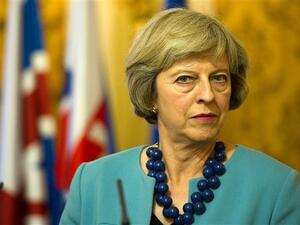 PM Theresa May announces UK will 'stop all defense engagement and training of Burmese military' (AFP/File)