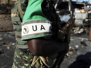 An African Union soldier patrols the scene of an al-Shabaab attack in Mogadishu in 2014. (AFP/Mohamed Abdiwahab)