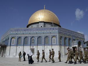 Israeli soldiers walk past the Dome of the Rock in the Al-Aqsa mosque compound, Islam's third-holiest site. (AFP/ File Photo)