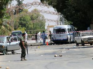 Lebanese security forces marked off the site of Monday morning's suicide bombings in al-Qaa, less than 24 hours before three more suicide bombings hit the town. (AFP/Stringer)