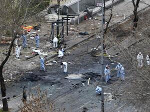 Forensic experts investigate the scene of an explosion on March 14, 2016 the day after a suicide car bomb ripped through a busy square in central Ankara killing at least 37 people and wounding 125. (AFP/Adem Altan)