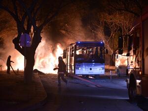 Firefighters try to extinguish flames following an explosion after an attack targeted a convoy of military service vehicles in Ankara on February 17, 2016. (AFP/Stringer)