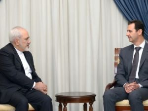 وزير الخارجية الايراني محمد جواد ظريف خلال لقائه الرئيس السوري بشار الاسد في دمشق