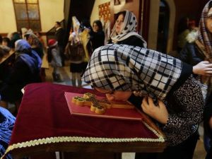 Assyrian Christians from Iraq, Syria and Lebanon arrive to attend a Christmas mass at Saint Georges church in an eastern Beirut suburb. (AFP/Ahmad al-Rubaye)