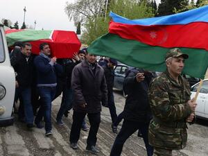 Men carry the coffin of an Azerbaijan's serviceman, who was killed on April 2 during clashes between Armenian and Azeri forces in Armenian-seized Azerbaijani region of Nagorny Karabakh, during his funeral in Terter on April 3, 2016. (AFP/Tofik Babayev)