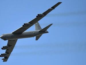 A B-52 Stratofortress flew alongside two jets near Osan, South Korea. (AFP/Raul Arborleda)