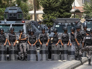 Jordanian security forces on guard before protesters near Israeli Embassy in Amman (AFP/File Photo)	