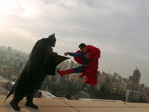 Beirut becomes Gotham city for a day as Batman and Superman battle it out on the rooftops in April 2016.  (AFP/Patrick Baz)
