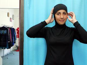 This file photo taken on January 12, 2007 shows Australian model Mecca Laalaa wearing an Islamic swimsuit (or burkini) by Muslim fashion designer Aheda Zanetti at the Islamic Sport & Swimwear shop in Sydney. (AFP/Anoek de Groot)