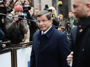 Turkish Prime Minister Ahmet Davutoglu arrives on the second day of the European Union summit to discuss the ongoing refugee crisis, in Brussels on March 18, 2016. (AFP/Stephane de Sakutin)