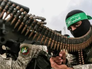 Fighters from the Ezzedine al-Qassam Brigades, the armed wing of the Palestinian Hamas movement, take part in a military show. (AFP)