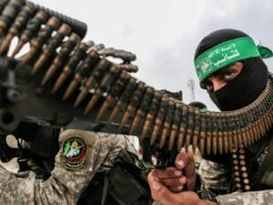 Fighters from the Ezzedine al-Qassam Brigades, the armed wing of the Palestinian Hamas movement, take part in a military show. (AFP)