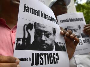 Sri Lankans hold images of slain journalist Jamal Khashoggi outside the Saudi embassy in Colombo (AFP/ File Photo)