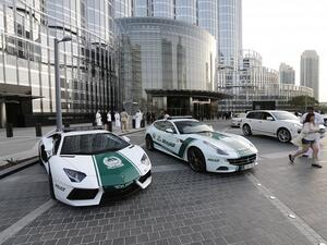 A picture taken on April 25, 2013 shows a Lamborghini (L) and Ferrari police vehicles at the foot of the Burj Khalifa tower in Dubai. (AFP/ Karim Sahib) A picture taken on April 25, 2013 shows a Lamborghini (L) and Ferrari police vehicles at the foot of the Burj Khalifa tower in Dubai. (AFP/ Karim Sahib)