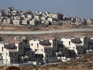 Israel's controversial barrier separating the Israeli settlement of Neve Yaakov. (AFP/File)