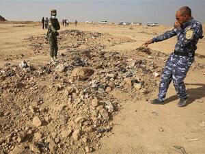 A mass grave discovered south of Mosul in Nov. 2016 (AFP/File)