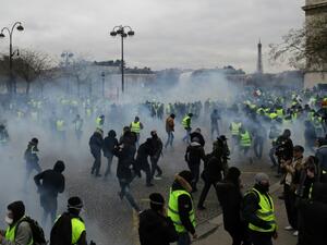 Police fired tear gas and water cannon to disperse advancing "yellow vest" protesters at the Arc de Triomphe in Paris. (AFP/ File)