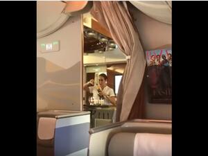 Emirates is so poor that its flight attendants have to pour drinks back into their bottles. (YouTube) Emirates is so poor that its flight attendants have to pour drinks back into their bottles. (YouTube)