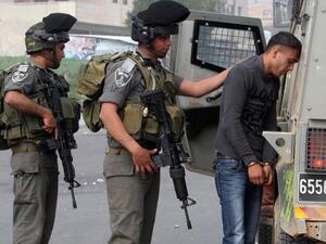Palestinian protester being detained by IDF soldiers. (AFP/Jaafar Ashtiyeh)