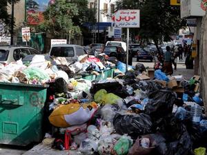 Garbage bags block the sidewalk of Hamra Street in the Lebanese capital Beirut. (AFP/Joseph Eid)