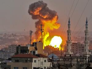 Fireball exploding in Gaza City during Israeli bombardment.