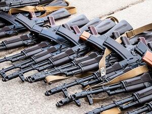 A representational pile of guns. (Shutterstock)