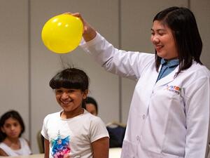 Young participants engrossed in activities that taught them about electricity, circuits, and breakers at QF’s.