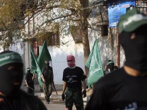 Palestinian Hamas militants rally in the streets of the Bureij refugee camp in central Gaza Strip on Dec. 25, 2009. (AFP/Mohammed Abed)