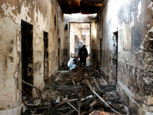 Staff investigate a Doctors Without Borders hospital in Afghanistan bombed by the US in October 2015. (AFP: Najim Rahim)