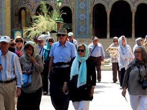 A photo shows foreign tourists visiting Tehran's Golestan Palace on August 5, 2015. (AFP/ Atta Kenare)