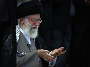 RAN, Tehran : A handout picture released by the official website of Iran's supreme leader, Ayatollah Ali Khamenei, shows him leading Eid al-Fitr prayers at Tehran University in the Iranian capital on August 9, 2013.  "AFP PHOTO / HO / KHAMENEI.IR"